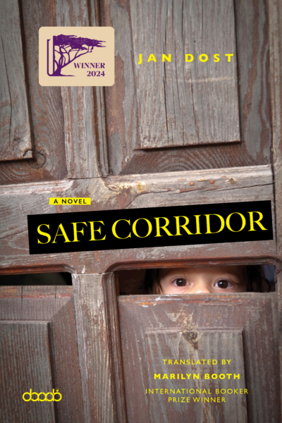 Cover of the novel Safe Corridor by Jan Dost, translated by Marilyn Booth. The background features a weathered wooden door with a small opening through which a child's wide eyes peer out, evoking fear and curiosity. A bold black title strip diagonally reads "SAFE CORRIDOR" in bright yellow letters. Additional text includes "A Novel," "Translated by Marilyn Booth, International Booker Prize Winner," and a badge stating "Winner 2024" with the Bait AlGhasham DarArab International Translation Prize logo. The DarArab logo appears in the bottom left corner.